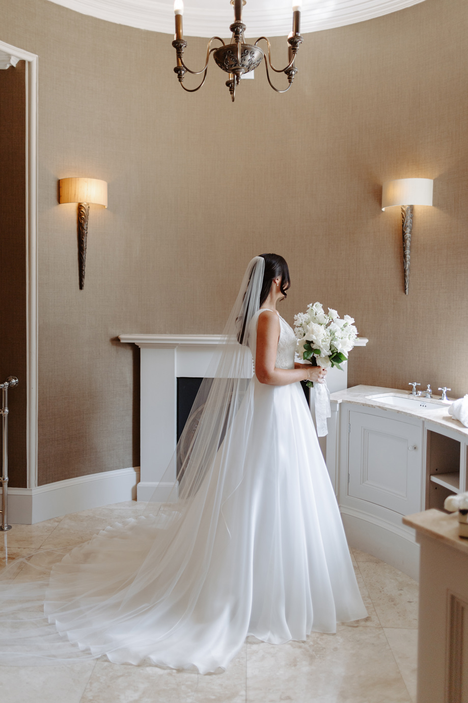 Shot of brides back as she prepares to walk down the aisle